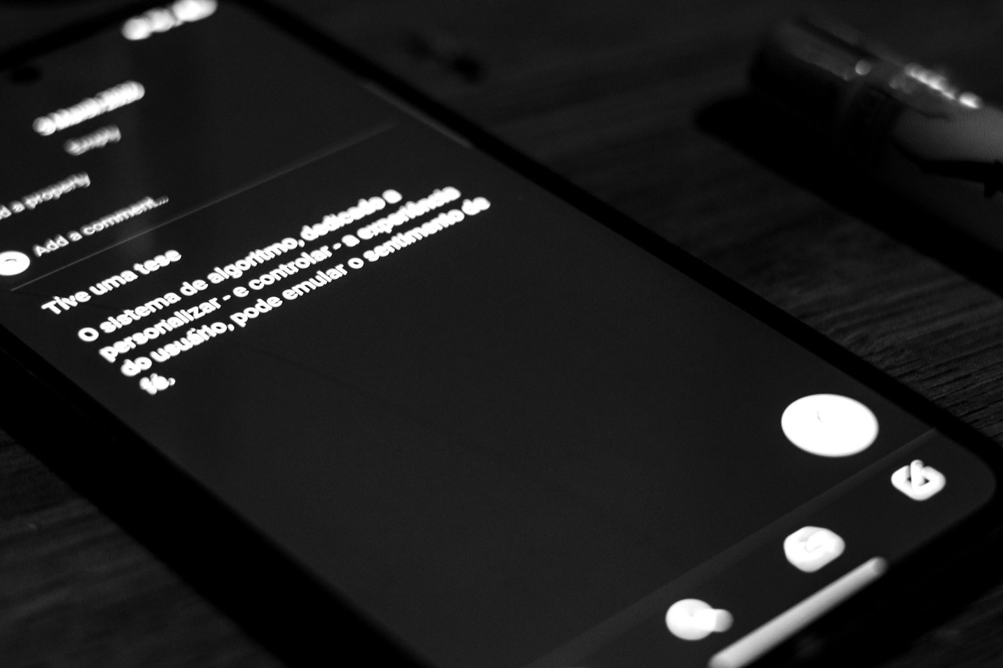 Smartphone displaying white text on a textured wooden surface.